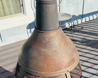 Chimineas typically have a bulbous body and a vertical smoke vent or chimney.
