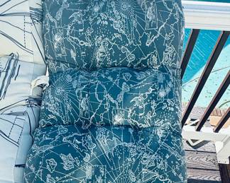 outdoor chair cushions featuring a nautical map pattern. These are likely part of the Tommy Bahama South Seas collection.