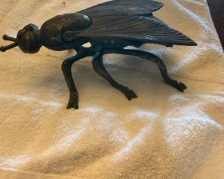 vintage brass fly ashtray, which is a collectible item that often doubles as a trinket box.