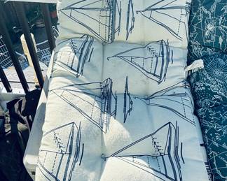 high-back chair cushion with a navy blue and white sailboat pattern.