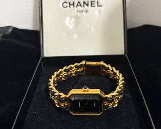 The Chanel Première Gold Plated Leather Chain Women’s Watch is a timeless piece that seamlessly blends elegance with the brand’s iconic design elements. Its distinctive octagonal case, inspired by the Place Vendôme, and the interlaced leather and gold-plated chain bracelet echo Chanel’s classic handbag chains, making it a versatile accessory suitable for both day and evening wear


&#128368;️ Chanel Première Gold Braided Black Leather Wristwatch - Timeless Elegance
