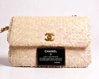 CHANEL 1990 Vintage White Sequin Shoulder Bag with Gold Chain – Mint with Tags & Authenticity Card

✨ Description:
Elevate your collection with this rare and exquisite Chanel 1990 White Sequin Shoulder Bag, a showstopping vintage piece from one of the most iconic eras in fashion. This elegant shoulder bag is adorned with brilliant white sequins, framed by black fabric sides and a fabric-lined interior, finished with gold-tone hardware for a striking contrast.

The gold and black woven chain strap and signature interlocking CC turn-lock closure exude Chanel’s timeless luxury. Preserved in mint condition, this collector’s piece comes with the original tags and authenticity card, making it as rare as it is beautiful.

