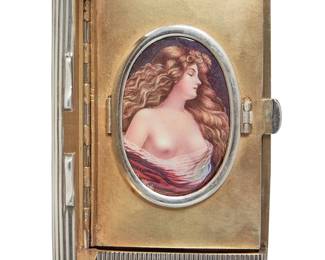 160
A Russian Silver Cigarette Case with Limoges Enamel Portrait
Featuring a heavily ridged lid and body, with secondary inner vanity compartment featuring inset Limoges enameled copper plaque portrait of a woman, with inscription in Cyrillic script to inner lid, "1883-1908", with Russian assay and maker's marks, and for 875 silver

Measures: 3 5/8 x 2 1/2 x 3/4 in.
187.3 grams gross
Estimate: $2,500 - $3,500