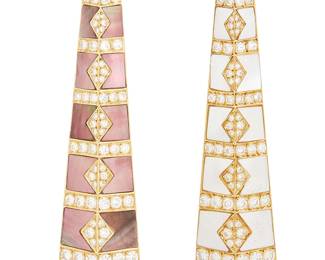 105
Gemlok: A Pair of 18k Gold and Mother-of-Pearl Brooches
Of a geometric design featuring mother-of-pearl inlay accented by round diamonds weighing approximately 4.65 carats total, signed Gemlok
2 pieces

Measures: 2 3/4 x 3/4 in.
37.7 grams gross
Estimate: $3,500 - $4,500