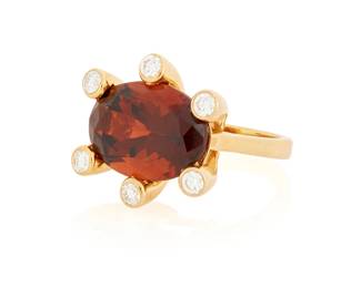 189
An 18K Gold, Garnet and Diamond Ring
Featuring an oval garnet weighing approximately 16.57 carats, accented by six round diamonds weighing approximately 0.72 carat

Size: 7 1/2
15.1 grams gross
Estimate: $2,500 - $3,500