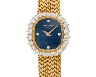268
Patek Philippe: An 18K Gold and Diamond Watch
Dial: 16.00 mm, oval navy dial with diamond set hour markers
Model:
Case: 25.00 mm, encircled by round diamonds weighing approximately 1.88 carats
Case number: 4137/5, 2792222 serial
Closure: gold bracelet with jewelry clasp
Signed:dial and clasp

Inner circumference: 6 1/2 in.
49.6 grams gross
Estimate: $4,000 - $6,000