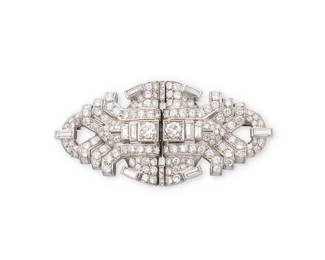 170
A Platinum and Diamond Double-Clip Brooch, c.1930
Of a geometric design featuring old European-cut, single-cut, transitional-cut and baguette diamonds weighing approximately 9.85 carats

Measures: 2 5/8 x 1 1/4 in.
37.1 grams gross
Estimate: $6,000 - $8,000