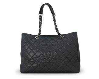 271
CHANEL: A Black Caviar Grand XL Shopping Tote, 2010
Circa 2010, Italy
Marked to interior grey leather tag: Chanel / ® / Made in Italy; Carte D'Authenticité and interior tag: No. 13355559
The extra-large bag in black textured leather with diagonal quilting, branded aged ruthenium hardware, exterior pocket, and leather chain handles, fully lined in grey satin fabric, with multiple interior pockets, including a central zipped pocket and a grey leather key fob strap, with original box and dust bag

13 x 17 x 7 in. / 33 x 43 x 17.5 cm; handle drop: 11 in. / 28 cm
Estimate: $3,000 - $5,000