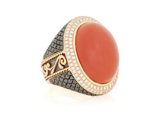 152
An 18K Gold, Carnelian and Diamond Ring
Featuring an oval carnelian cabochon measuring approximately 22.53 x 16.60 x 10.59 mm accented by round black and near colorless diamonds weighing 4.06 carats

Size: 7
23.2 grams gross
Estimate: $2,000 - $3,000