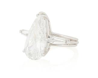 209
A Platinum and Diamond Ring
Centering a pear-shaped brilliant-cut diamond weighing 4.14 carats, flanked by two tapered baguettes

Size: 4 1/4
6.1 grams gross

Accompanied by a GIA Report numbered #2235101066, dated October 25, 2023, stating the diamond as Natural with a color grade of E and a clarity grade of S12, medium blue fluorescence.
Estimate: $25,000 - $35,000
