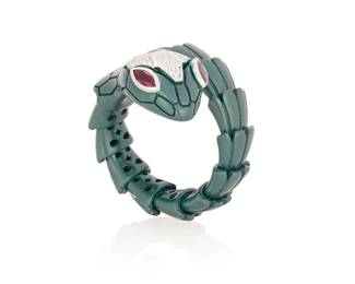 219
Alexis NY: A Titanium, 18K White Gold, and Diamond Ring
Featuring articulated titanium links finished with 18k white gold accented by round diamonds and marquise-shaped rubies, signed Alexis N.Y.

Size: 6 1/4
7.4 grams gross
Estimate: $2,000 - $3,000