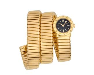 244
Bulgari: An 18K Gold 'Serpenti Tubogas' Watch
Dial: 12.00 mm, round black dial with baton hour markers
Model: Serpenti Tubogas
Case: 18.00 mm
Case number: F13864, BB191T
Closure: flexible 18k gold tubogas wrap bracelet
Signed: dial, bracelet and case

Inner circumference: 6 1/2 in., flexible
128.4 grams gross
Estimate: $18,000 - $25,000