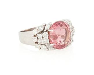 130
A 14K White Gold, Pink Tourmaline and Diamond Ring
Centering a round mixed-cut pink tourmaline weighing approximately 6.56 carats, accented by round and marquise-shaped diamonds

Size: 7 3/4
8.1 grams gross
Estimate: $3,000 - $5,000