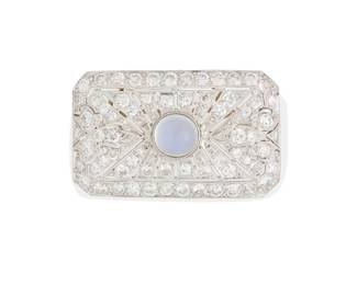 36
A 14K White Gold, Moonstone and Diamond Brooch/Pendant, c.1930
Centering a round moonstone cabochon measuring approximately 7.50 x 7.50 x 4.85mmm, accented by round diamonds weighing approximately 4.04 carats, all set in an ornate openwork frame

Measures: 1 1/2 x 7/8 in.
8.6 grams gross
Estimate: $3,000 - $5,000