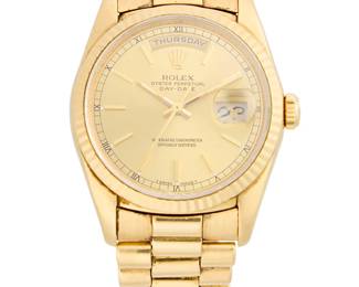266
Rolex: An 18K Gold 'Presidential' Watch
Dial: 30.00 mm, round gold dial with baton hour markers
Model: Presidential, E372791
Case: 35.00 mm
Case number: 18238
Closure: gold link bracelet with deployment clasp
Signed: dial and clasp, with 2 extra links

Inner circumference: 6 3/4 in.
133.9 grams gross
Estimate: $10,000 - $15,000