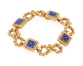 233
Carlo Weingrill: An 18K Gold and Lapis Lazuli Bracelet
Featuring looped links of textured gold, accented square links set with square French-cut lapis lazuli, signed with makers mark

Length: 7 3/4 in.
77.2 grams
Estimate: $10,000 - $15,000