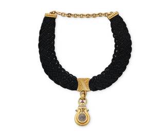 65
A Joan Boyce 18K Gold and Silk Collar with an 18K Gold and Ancient Coin Pendant
Featuring a woven black silk collar with 18k gold accents, signed JBC, suspending an18k gold, ancient Roman coin pendant accented by ruby and sapphire cabochons with round diamonds, with Italian workshop marks

Collar: 13 1/2 - 17 in.
58.2 grams
Estimate: $3,500 - $5,500