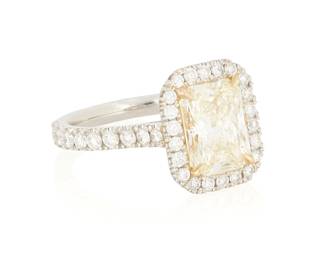 237
A Platinum, 18K Gold, Colored Diamond and Diamond Ring
Centering a rectangular radiant-cut colored diamond weighing approximately 2.26 carats, accented by round diamonds weighing 0.90 carat

Size: 6 3/4
7.1 grams gross
Estimate: $7,000 - $10,000