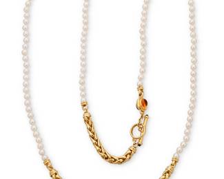 69
Joan Boyce: An 18K Gold, Cultured Pearl and Gem-Set Necklace
Featuring two braided segments of 18k gold accented by two oval double-sided citrine, amethyst and green tourmaline cabochons, finished with two long strands of cultured pearls measuring approximately 7.10-7.20 mm, signed JBL

Length: 51 1/2 in.
150.0 grams gross
Estimate: $3,000 - $5,000
