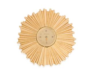 243
Verdura: A Gold Watch Brooch Clip
Featuring a round dial with gold bead hour markers, set in a starburst dimensional gold frame, dial signed Verdura

Measures: 1 3/4 x 1 3/4 in.
28.3 grams gross
Estimate: $2,800 - $3,500
