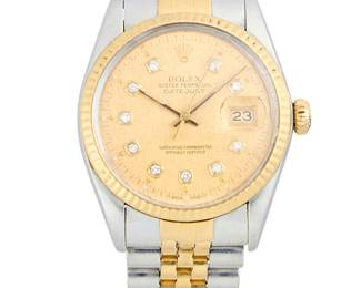 260
Rolex: A Stainless-Steel and Gold 'Datejust' Watch
Dial: 30.00 mm, round gold dial with diamond set hour markers
Model: Datejust
Case: 36.00 mm, with a fluted gold bezel
Case number: 455
Closure: stainless-steel link bracelet with deployment clasp
Signed: dial, movement and clasp, with original box

Inner circumference: 7 in.
94.7 grams gross
Estimate: $5,000 - $7,000