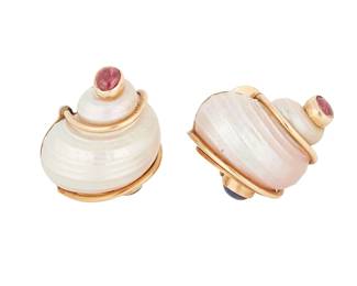 155
Seaman Schepps: A Pair of 14K Gold and Gem-Set Shell Earclips
Featuring two turbo shells lined with gold, accented by two oval ruby cabochons and two round sapphire cabochons, signed P.S.V of Seaman Schepps
2 pieces

Measures: 1 x 7/8 in.
20.0 grams gross
Estimate: $3,000 - $5,000