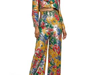 278
Maison Schiaparelli: A Floral Sequin Bolero Pant Suit
Circa 2010s-2020s, France
Label: Schiaparelli / 21 Place de Vendome, Paris
A two piece suit in silver and multicolored sequins in an all-over floral and abstract designs, comprising a boxy cropped long sleeved shirt jacket with button front, shoulder pads, and self-tie scarf collar, with a matching pair of sequin high-waisted corset pants, with an integral interior corset belt, wide legs, and side zip, each lined in black silk
2 pieces

Each: size 38 FR / US 6
Measurements:
Jacket: CB length: 14 1/2 in.; bust across front: 21 in.; waist across front: 20 in.; across shoulders at back: 16 in.; sleeves: 22 in.
Pants: waist across front: 14 1/2 in.; hips across back: 19 in.; inseam: 30 1/4 in.; back rise: 18 1/2 in.; hem width: 13 in.
Estimate: $1,000 - $1,500