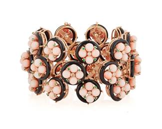 157
An 18K Rose Gold, Onyx and Coral Bracelet
Featuring tiered rings of black onyx, centering round coral beads accented by emeralds and round diamonds, with Italian workshop marks

Length: 7 in. Width: 1 1/2 in.
91.0 grams
Estimate: $14,000 - $18,000