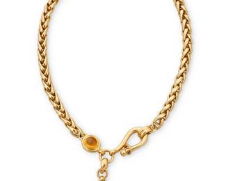 54
Joan Boyce: An 18K Gold, Citrine and Green Tourmaline Necklace
Featuring two oval citrine cabochons accented by a square-cut green tourmaline, with a removable pendant, pendant stamped JBL, chain signed Cesa

Length: 20 in., Pendant: 2 x 1 in.
106.5 grams
Estimate: $7,000 - $10,000