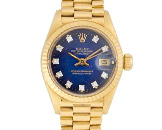 265
Rolex: An 18K Gold 'Oyster Datejust' Watch
Dial: 22.00 mm, navy round dial with round diamond hour markers
Model: Oyster Datejust
Case: 26.00 mm
Case number: 2030 movement, 5706727 serial, 6917
Closure: 18k gold link bracelet with deployment clasp
Signed: dial and clasp

Inner circumference: 5 1/2 in.
65.6 grams gross
Estimate: $3,000 - $5,000