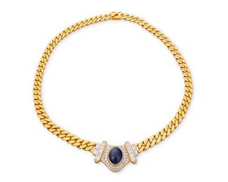 176
An 18K Gold, Sapphire and Diamond Necklace
Centering on oval sapphire double cabochon weighing approximately 9.98 carats, accented by round and baguette diamonds weighing approximately 2.50 carats, finished with a Cuban link chain

Length: 15 1/2 in.
61.3 grams gross
Estimate: $5,000 - $7,000