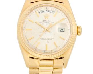 267
Rolex: An 18K Gold 'Presidential' Watch
Dial: 30.00 mm, round with baton hour markers
Model: Presidential
Case: 38.00 mm
Number: 1803, 2928959, 1556
Closure:18k gold link bracelet with deployment clasp
Signed: dial, movement and clasp

Inner circumference: 6 1/4 in.
111.4 grams gross
Estimate: $10,000 - $15,000