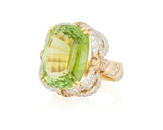 181
A Platinum, 18K Gold, Green Tourmaline and Diamond Ring
Centering a cushion modified step-cut green tourmaline weighing approximately 24.42 carats, accented by round brown and bear colorless diamonds weighing approximately 2.00 carats all set in an ornate mount

Size: 5 3/4
16.3 grams gross

Accompanied by a GIA Report numbered #d, dated April 2, 2025, stating the Tourmaline as natural Yellowish Green.
Estimate: $3,000 - $5,000