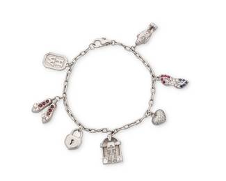 203
Harry Winston: A Platinum and Diamond Charm Bracelet
Featuring seven charms including a falcon, ruby slippers and a pave diamond heart, signed HW

Length: 7 1/2 in.
41.1 grams gross
Estimate: $15,000 - $20,000