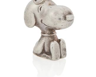 6
Cartier: A Silver Snoopy Pendant and Signed Book
Of a high polish seated design, signed Cartier, United Feature, 1958, 1966, accompanied by a copy of "Happiness is a Warm Puppy" signed by Charles Shulz
2 pieces

Pendant: 1 x 1/2 in., Book: 6 x 6 in.
28.1 grams gross
Estimate: $1,500 - $2,000