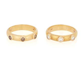 11
Elizabeth Locke: A Pair of Gold, Colored Diamond and Diamond Rings
Featuring three round near colorless diamonds and three round brown diamonds, signed with maker's marks
2 pieces

Size: 4 3/4 and 4 1/2
7.5 grams gross
Estimate: $1,500 - $2,500