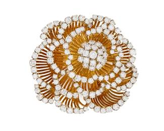 231
An 18K Bi-Color Gold and Diamond Brooch
Of a floral design featuring unfolding gold petals finished with round diamonds weighing approximately 10.05 carats

Measures: 2 x 2 in.
40.3 grams gross
Estimate: $15,000 - $20,000