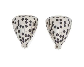 39
Cantamessa: A Pair of 18K White Gold and Sapphire Earrings
Of a peaked design set with round sapphires and accented by round diamonds weighing approximately 0.86 carat
2 pieces

Measures: 1 1/8 x 1 in.
28.4 grams gross
Estimate: $4,000 - $6,000