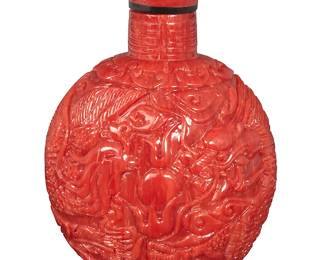 158
A Coral and Horn Snuff Bottle
A carved red coral panels featuring a dragon and phoenix motif, including a horn spoon

Measures: 3 1/2 x 2 1/2 in.
116.5 grams gross
Estimate: $2,500 - $3,500