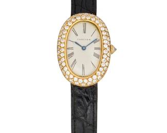 256
Cartier: An 18K Gold and Diamond Watch
Dial:15.00 mm, white oval dial with Roman numeral hour markers
Case: 24.00 mm, encircled by round diamonds weighing approximately 2.25 carats
Case number: 63589, 033467 serial
Closure: black leather strap with 18k gold deployment clasp
Signed: dial, case and clasp

Inner circumference: 6 in.
30.8 grams gross
Estimate: $3,500 - $5,500