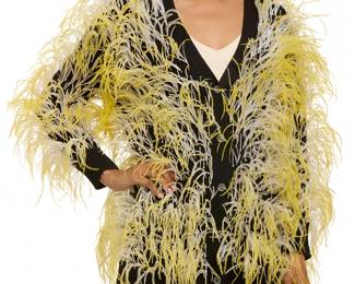 284
Libertine: A "Wham Bam" Black Cashmere Cardigan with Ostrich Feathers, 2024
Circa 2024, Los Angeles, CA
Labeled for Libertine
The long button-front dropped shoulder sweater with long sleeves, patch pockets and adorned with applied lines of white beadwork and yellow and white ostrich feathers

Size S
Measurements: CB length: 29 in.; bust across front: 20 in.; sleeves: 22 in.
Estimate: $600 - $800