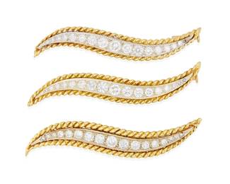 24
Three 18K Gold and Diamond Brooches
Of a swoosh design featuring graduated round diamonds weighing 3.90 carats total, accented by twisted yellow gold rope frames, one signed VCA 1V674237, one signed 1v0174 partial V.C stamp
3 pieces

Measures: 2 1/4 x 1/4, 2 1/8 x 1/4 and 2 1/4 x 3/8in.
17.6 grams gross
Estimate: $10,000 - $15,000