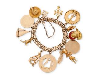 76
A Gold and Gem-Set Charm Bracelet
Suspending fourteen charms featuring a mermaid, a kangaroo, the state of California and the #21

Length: 7 in, Charms: 1/2 - 1 3/8 in.
80.1 grams gross
Estimate: $5,000 - $7,000