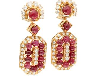 17
A Pair of 18K Gold, Ruby and Diamond Earrings
Of an ornate geometric design featuring round ruby cabochons, accented by round diamonds weighing approximately 4.80 carats
2 pieces

Measures: 2 x 3/4 in.
30.4 grams gross
Estimate: $4,000 - $6,000