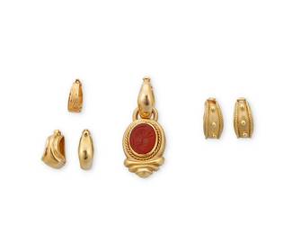 72
A Group of Gold Bails and a Pendant including Joan Boyce
Including four 18k gold bails signed JBC, a Joan Boyce carnelian intaglio pendant signed JBC, an 18k gold bail and a 14k gold bail

Measures: 1/2 - 5/8 in., Pendant: 1 1/2 in.
21.4 grams
Estimate: $1,500 - $2,000