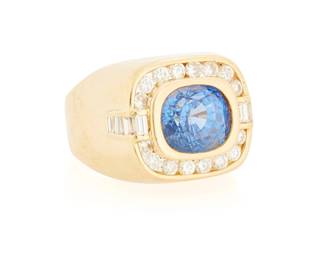 234
An 18K Gold, Sapphire and Diamond Ring
Centering a rectangular cushion-cut sapphire measuring approximately 11.62 x 9.88 x 9.21 mm, accented by round and baguette diamonds weighing approximately 1.40 carats

Size: 11 1/2
21.6 grams gross

Accompanied by a GIA Report numbered #5232779544, dated November 18, 2025, stating the Sapphire as natural Corundum with heat treatment.
Estimate: $4,000 - $6,000