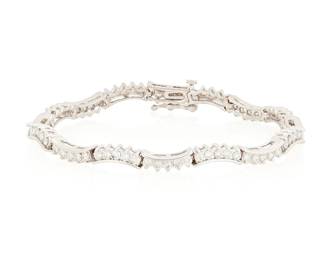 212
A 14K White Gold and Diamond Bracelet
Featuring curved links set with round diamonds weighing approximately 3.20 carats

Length: 7 1/4 in.
13.4 grams gross
Estimate: $1,200 - $1,800