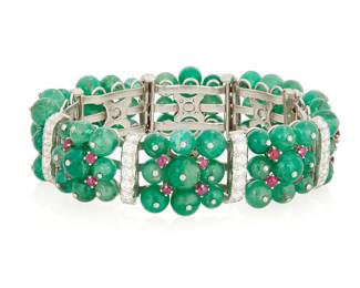 48
David Webb: A Platinum, Emerald, Ruby and Diamond Bracelet
Featuring links set with nine round emerald beads, accented by round ruby cabochons and finished with bars set with round diamonds weighing approximately 5.60 carats, signed David Webb, na74

Length: 7 1/2 in., Width: 3/4 in.
93.8 grams gross
Estimate: $25,000 - $35,000
