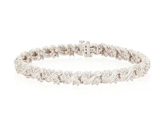210
A 14K White Gold and Diamond Bracelet
Featuring an interlocking pattern set with round and tapered baguette diamonds weighing approximately 4.00 carats

Length: 7 1/2 in.
21.9 grams gross
Estimate: $2,000 - $3,000
