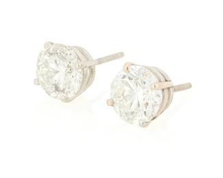 112
A Pair of 14K White Gold and Diamond Stud Earrings
Featuring two round diamonds weighing 2.06 and 2.00 carats

Measures: 1/4 in.
2.9 grams gross

Accompanied by a GIA Report numbered #5231603653, dated June 12, 2025, stating the 2.06 carat diamond as Natural with a color grade of N and a clarity grade of I2, medium fluorescence.

Accompanied by a GIA Report numbered #6237603656, dated June 12, 2025, stating the 2.00 carat diamond as Natural with a color grade of M and a clarity grade of I2, faint fluorescence.
.
Estimate: $2,500 - $3,500